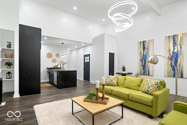 living room featuring beamed ceiling, a chandelier, high vaulted ceiling, and dark hardwood / wood-style flooring