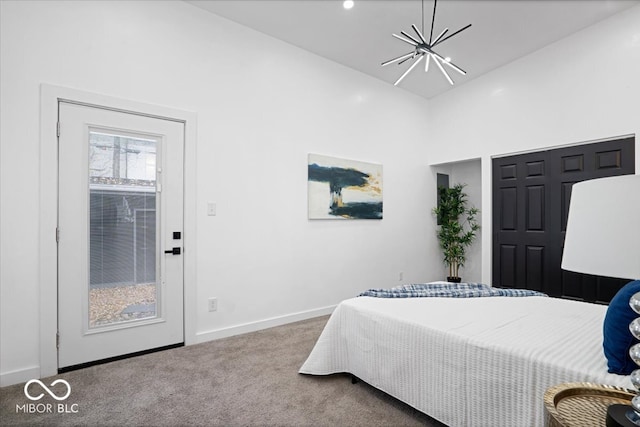 bedroom featuring a notable chandelier, carpet floors, and high vaulted ceiling