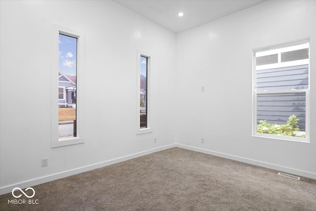 unfurnished room featuring carpet floors