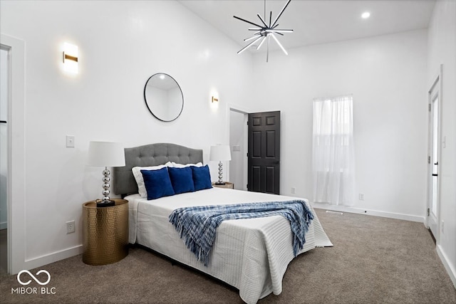 carpeted bedroom featuring high vaulted ceiling