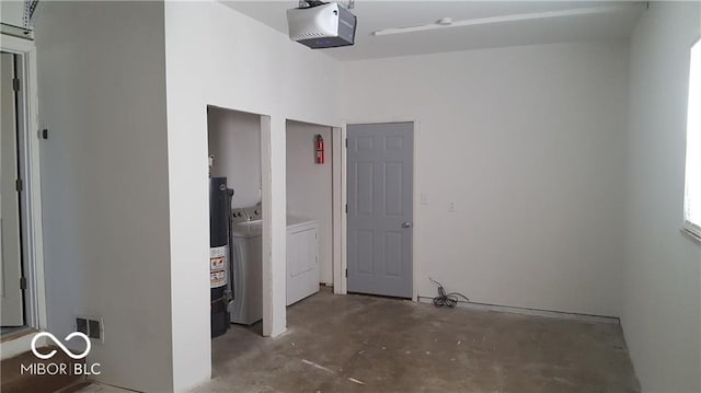 interior space featuring a garage door opener and separate washer and dryer