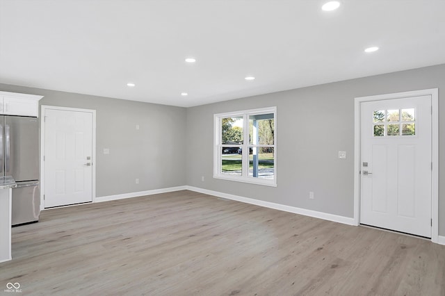 entryway with a healthy amount of sunlight and light wood-type flooring