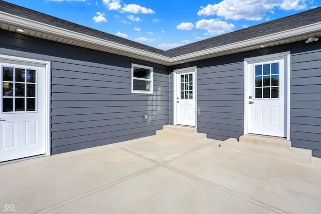 property entrance with a patio area