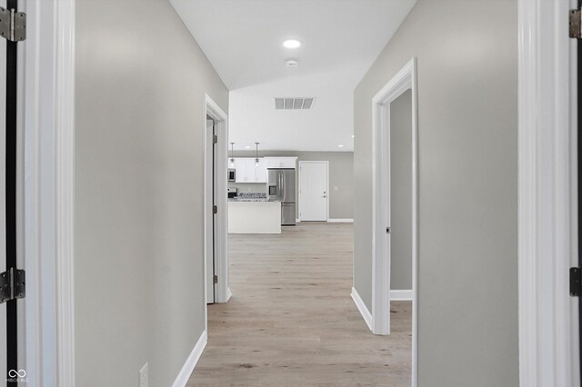 7234 N Christopher Ln, Fairland, IN 46126 - hall featuring light wood-type flooring, visible vents, and baseboards