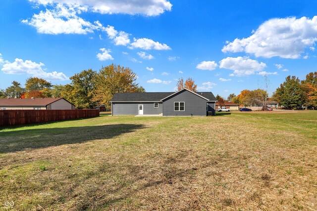 7234 N Christopher Ln, Fairland, IN 46126 - rear view of property with a lawn and fence