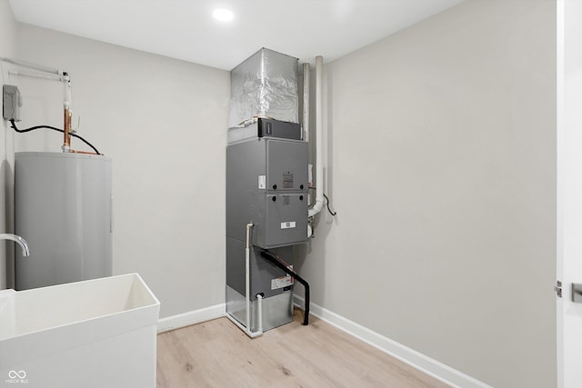 utilities featuring sink and water heater