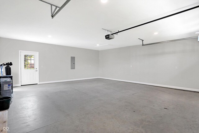 7234 N Christopher Ln, Fairland, IN 46126 - garage with baseboards, recessed lighting, and a garage door opener