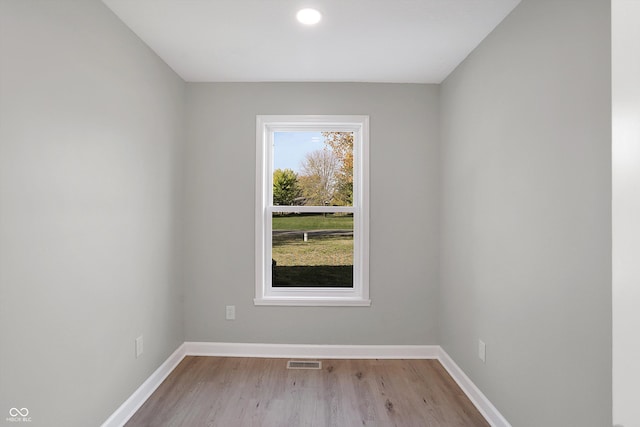 spare room featuring light hardwood / wood-style floors