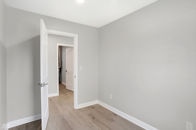 unfurnished room with light hardwood / wood-style floors