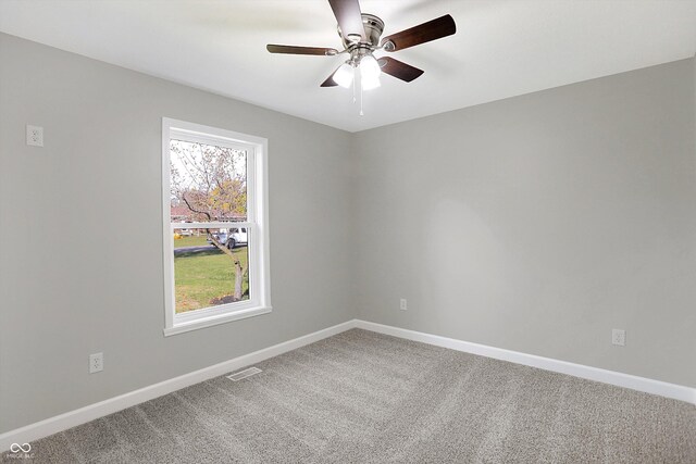 7234 N Christopher Ln, Fairland, IN 46126 - spare room with baseboards, a ceiling fan, visible vents, and carpet floors