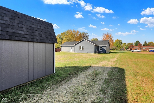 view of yard with a storage unit