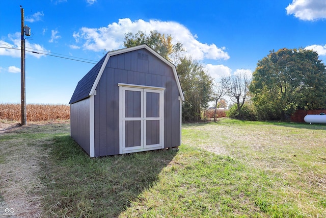 view of outdoor structure with a lawn