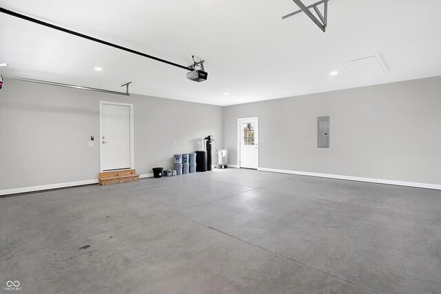 7234 N Christopher Ln, Fairland, IN 46126 - garage featuring electric panel, baseboards, recessed lighting, and a garage door opener