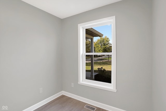 unfurnished room featuring wood-type flooring