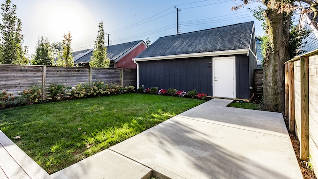 view of yard featuring a storage shed and a patio area