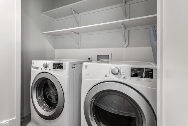 laundry area featuring washing machine and clothes dryer