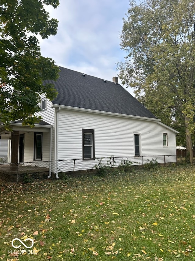 view of property exterior featuring a lawn