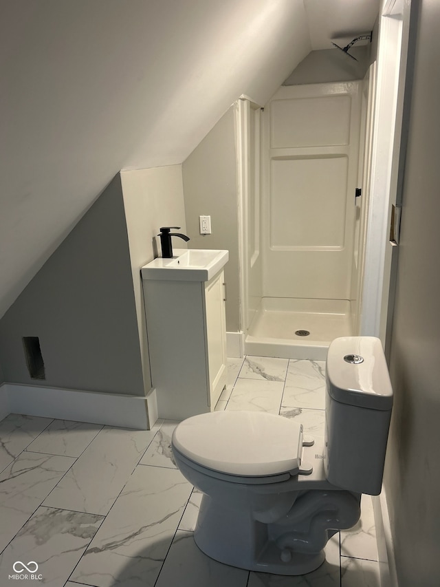 bathroom featuring vanity, vaulted ceiling, toilet, and walk in shower