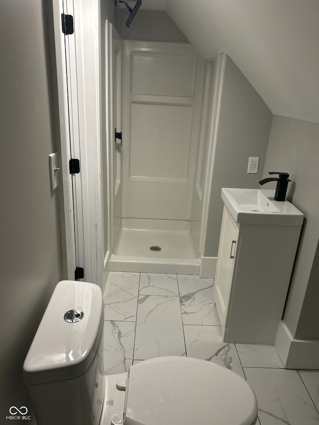 bathroom featuring vanity, vaulted ceiling, toilet, and walk in shower