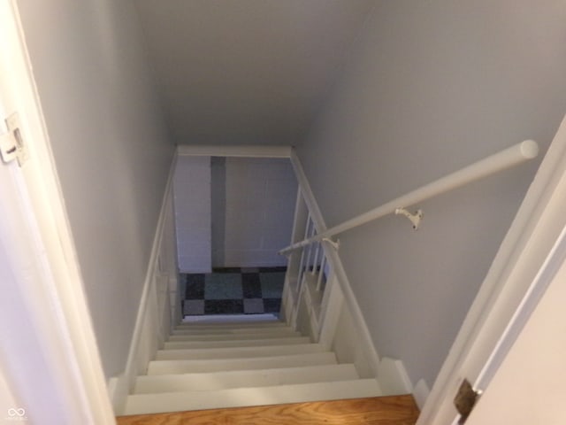 stairway with wood-type flooring