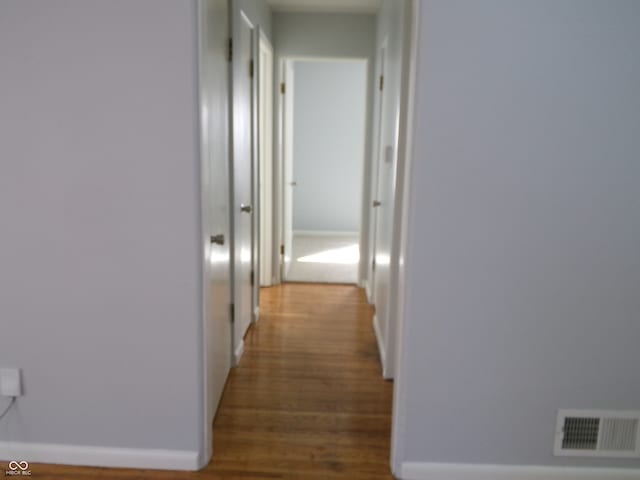 hallway featuring hardwood / wood-style floors