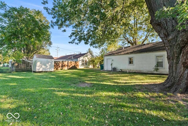 view of yard with a storage shed and cooling unit