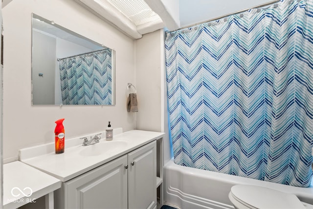 full bathroom featuring vanity, toilet, and shower / bath combination with curtain