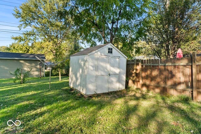 view of outdoor structure with a lawn