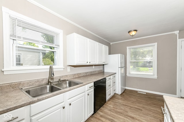 kitchen with sink, dishwasher, white cabinets, and a healthy amount of sunlight