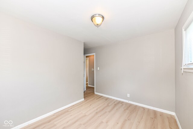 unfurnished room featuring light hardwood / wood-style flooring