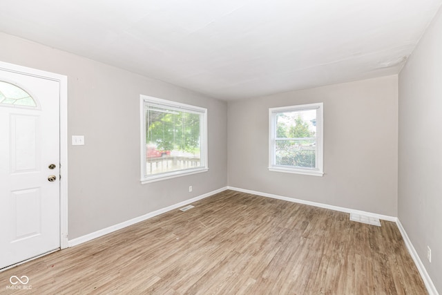 entryway with light hardwood / wood-style flooring