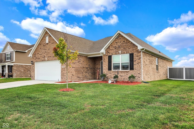 view of front facade with a front yard and a garage