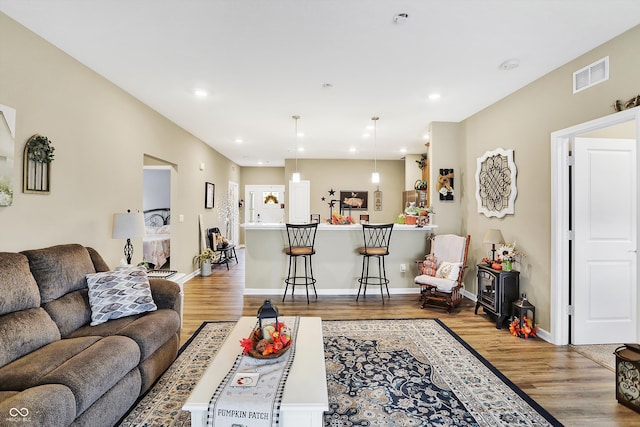 living room with light hardwood / wood-style flooring