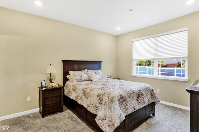 bedroom with light colored carpet