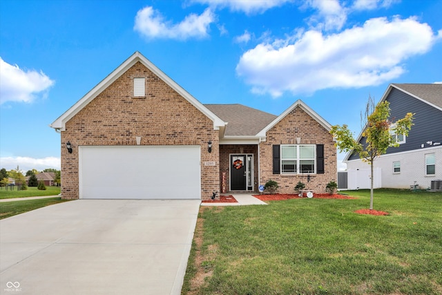 view of front of home with a front lawn, central AC, and a garage