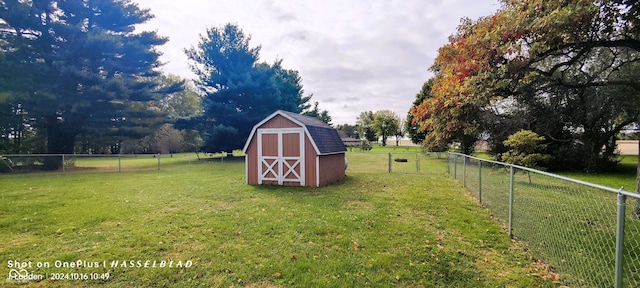 view of outbuilding featuring a lawn