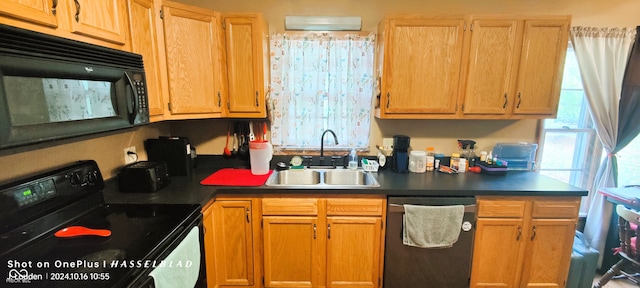 kitchen with black appliances and sink