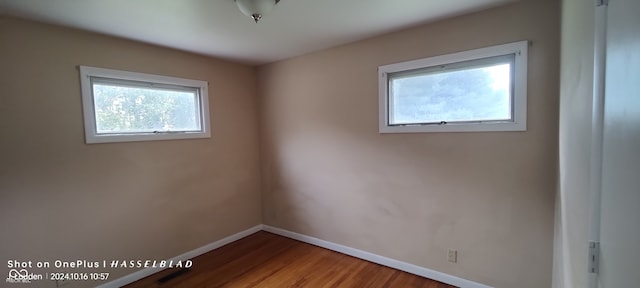 spare room featuring hardwood / wood-style flooring