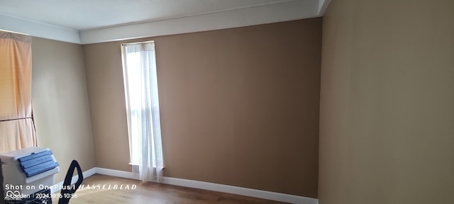 spare room featuring hardwood / wood-style flooring