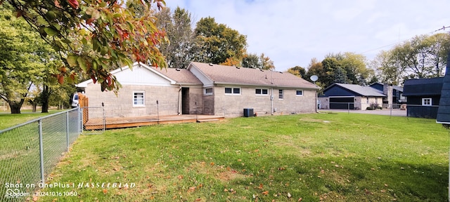 rear view of property featuring a yard