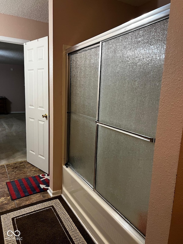 bathroom featuring enclosed tub / shower combo