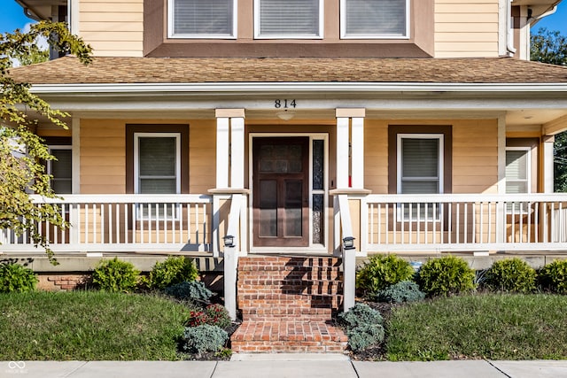 doorway to property featuring a porch