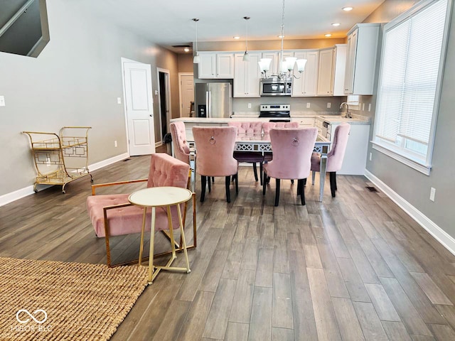 dining room featuring hardwood / wood-style flooring and sink