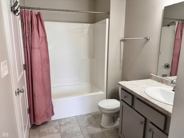 full bathroom featuring vanity, tile patterned floors, toilet, and shower / bath combo