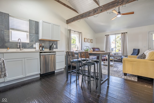 kitchen featuring dishwasher, a wealth of natural light, dark hardwood / wood-style floors, and white cabinetry