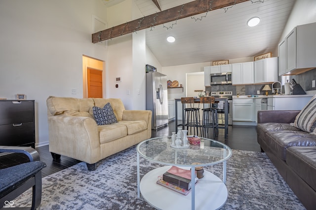 living room with high vaulted ceiling, beam ceiling, and wood ceiling