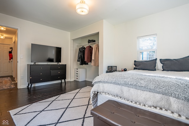 bedroom featuring a closet and dark hardwood / wood-style flooring