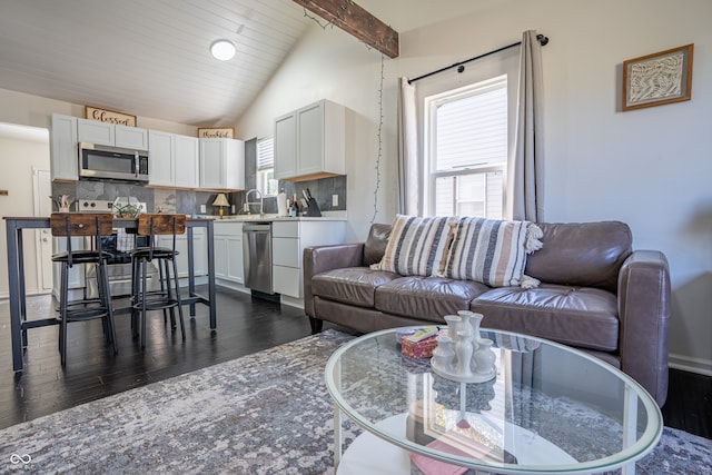 living room featuring vaulted ceiling with beams, sink, dark hardwood / wood-style flooring, and wooden ceiling