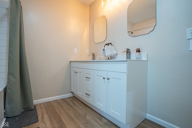 bathroom featuring hardwood / wood-style flooring and vanity