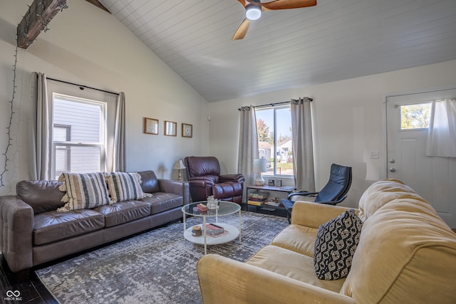 living room with plenty of natural light, vaulted ceiling, hardwood / wood-style flooring, and ceiling fan